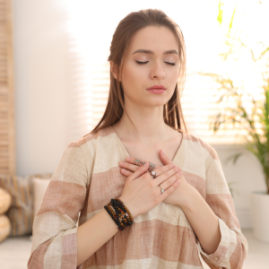 Woman meditating peacefully indoors